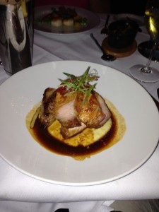 "Smoked Hampshire" pork chop with "chiles, cheesy polenta, bbq onions".